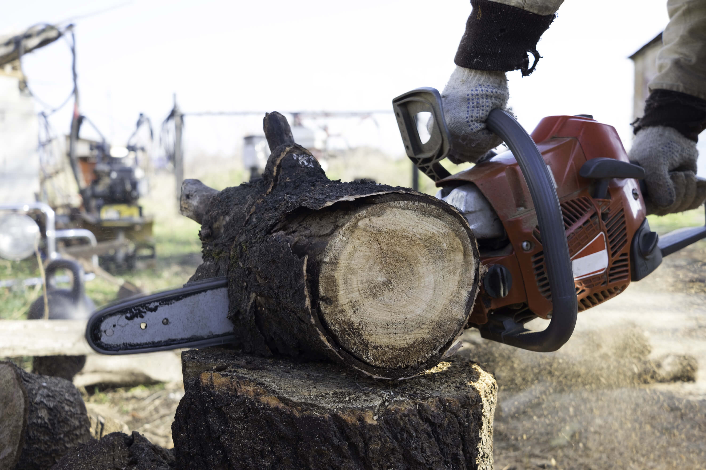 Cut Materials With a Hand Held Chainsaw